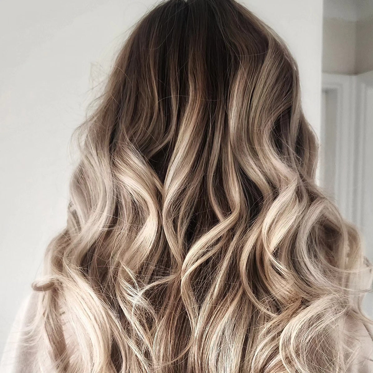 Soft brunette root melting into blonde balayage waves by NED.K HAIR, mobile hairdresser Central Coast NSW