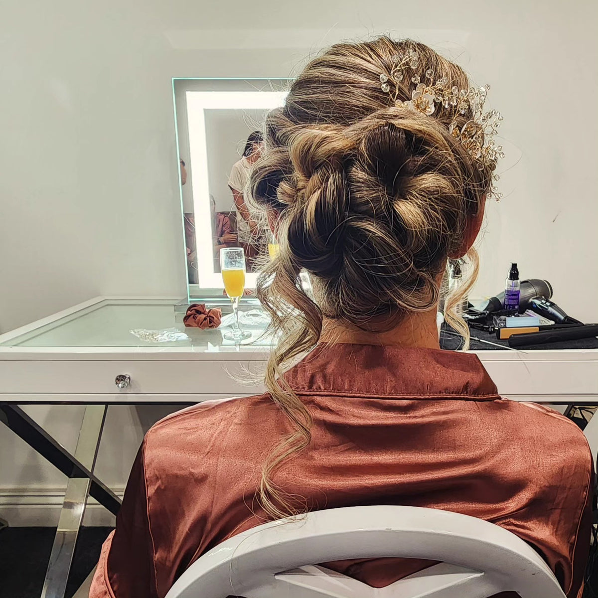 Textured bridal updo with braided detail and hair accessory – NED.K HAIR