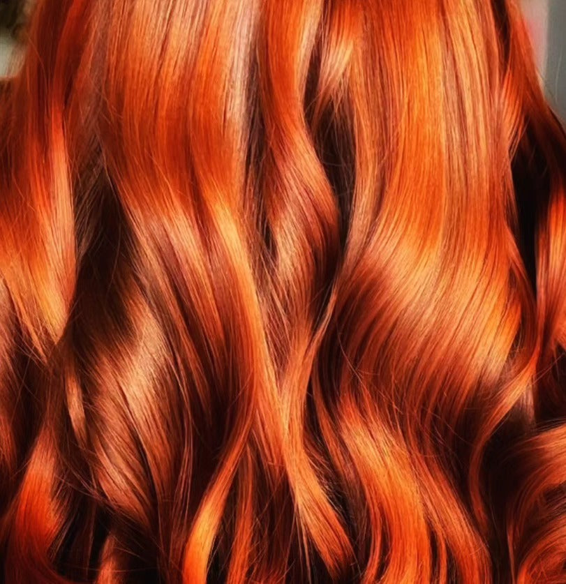 Vibrant copper hair colour with glossy waves – NED.K HAIR